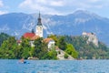 Lake Bled, Slovenia - August 20, 2018: People enjoy the water in summer among a green and lush natural landscape and some