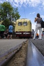 Visitors to the Moscow tram exhibition take photos of the retro MTV 82 car