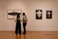 Visitors to the museum look at the painting Royalty Free Stock Photo