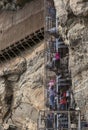 Visitors to Sigiriya Rock Fortress climb the spiral staircase leading to the ancient frescoes cave.