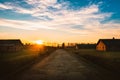 Visitors tourist enters walk around camp in Oswiecim, Poland. Barracks and elecrified fencing