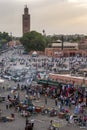 Visitors and vendors crowd the colourful Djemaa el-Fna, the main square in the Marrakesh medina in Morocco. Royalty Free Stock Photo