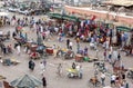 Visitors and vendors crowd the colourful Djemaa el-Fna, the main square in the Marrakesh medina in Morocco. Royalty Free Stock Photo