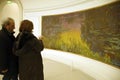 Visitors view Monet's giant water lily oils