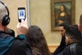 Visitors view and photograph the Mona Lisa Royalty Free Stock Photo