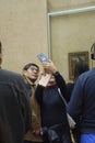 Visitors view and photograph the Mona Lisa Royalty Free Stock Photo