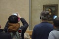 Visitors view and photograph the Mona Lisa Royalty Free Stock Photo