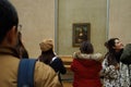 Visitors view and photograph the Mona Lisa Royalty Free Stock Photo