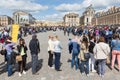 Visitors waiting in long queues to visit the Palace of Versailles, Paris, France