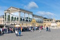 Visitors waiting in a queue to visit the Palace of Versailles, Paris, France