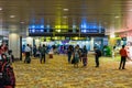 Visitors walk around Departure Hall in Changi Airport Singapore Royalty Free Stock Photo