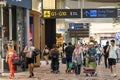 Visitors walk around Departure Hall in Changi Airport Terminal 4, Singapore Royalty Free Stock Photo