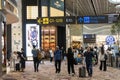 Visitors walk around Departure Hall in Changi Airport Terminal 4, Singapore Royalty Free Stock Photo