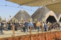 Visitors walk in front of EXPO CENTRE pavilion, EXPO 2015 Milan