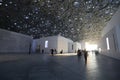 Visitors walk through the grounds of the Louvre Abu Dhabi in the UAE capital