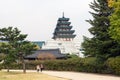 Visitors walk with the National Folk Museum of Korea in background Royalty Free Stock Photo