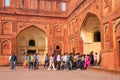 Visitors walking in the courtyard of Jahangiri Mahal in Agra For