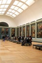 Visitors wandering through rooms filled with masterpieces,The Louvre,Paris,France,2016 Royalty Free Stock Photo