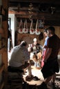 Visitors watching tailors sew leather garments,Fort Ticonderoga,New York,2014