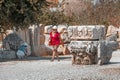 Visitors wearing medical masks and tour guides with tourists walk through the ancient city of