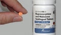 Vista, CA / USA - January 17, 2019: Hand holding a pill of Buprenorphine-Naloxone