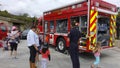 Vista, CA / USA - October 13, 2018: People interact with firefighters and explore trucks during fire prevention month open house.