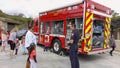 Vista, CA / USA - October 13, 2018: People interact with firefighters and explore trucks during fire prevention month open house.