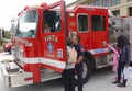 Vista, CA / USA - October 13, 2018: People interact with firefighters and explore trucks during fire prevention month open house.