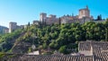 Vista de la majestuosa Alhambra sobre los tejados de las casas d Royalty Free Stock Photo
