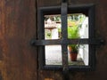 Vista A TravÃÂ©s De Ventana De Una Puerta Colonial