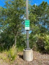 A vistors parking sign in a parking lot Royalty Free Stock Photo