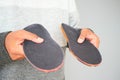 Visual comparison of two shoe insoles showcasing design and texture differences