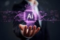Hand holds a glowing purple digital object resembling a futuristic chip with AI displayed