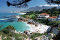 Visual a panoramic view of the cape town beach area, showcasing its white sandy beaches and clear blue waters with some build Royalty Free Stock Photo