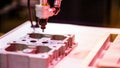 A visual representation of a robotic system that deploys ultrasonic sensors to detect flaws within complex geometric