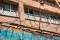 A visual representation of urban decay and heightened security in an abandoned prison structure Royalty Free Stock Photo