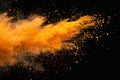 Visual yellow powder explosion isolated on a white background, shown from above. orange colored dust splash or grain texture Royalty Free Stock Photo
