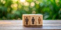 Visualizing Attendance and Population Counts A Small Wooden Cube with Miniature People Royalty Free Stock Photo