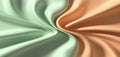 Abstract swirling fabric texture with soft pastel green and warm peach hues Royalty Free Stock Photo