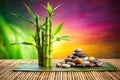 Serene Bamboo and Pebble Stack on a Textured Surface with Vibrant Background stones wellness Royalty Free Stock Photo