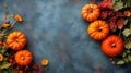 Autumnal Arrangement with Pumpkins and Floral Adornments on Textured Backdrop Royalty Free Stock Photo