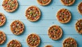 Colorful Mini Pizzas on Blue Wooden Table Flat Lay Royalty Free Stock Photo