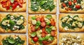 Assortment of Gourmet Flatbreads with Fresh Toppings Royalty Free Stock Photo