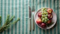 A simple still life of apples, grapes, and rosemary on a table setting. Generative AI Royalty Free Stock Photo