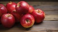 Cluster of Plump, Vibrant Red Apples Set on Wooden Table
