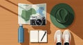 Flat Lay of Travel Essentials: Map, Camera, Hat, Water Bottle, Notebook, and Sneakers Royalty Free Stock Photo
