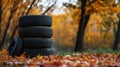 A visually engaging image of a stack of old and new tires, background