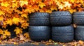 A visually engaging image of a stack of old and new tires, background