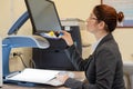 A visually impaired woman uses special reading equipment