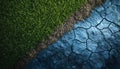 A visually striking contrast between flourishing green grass, cracked earth, and a blue surface Royalty Free Stock Photo